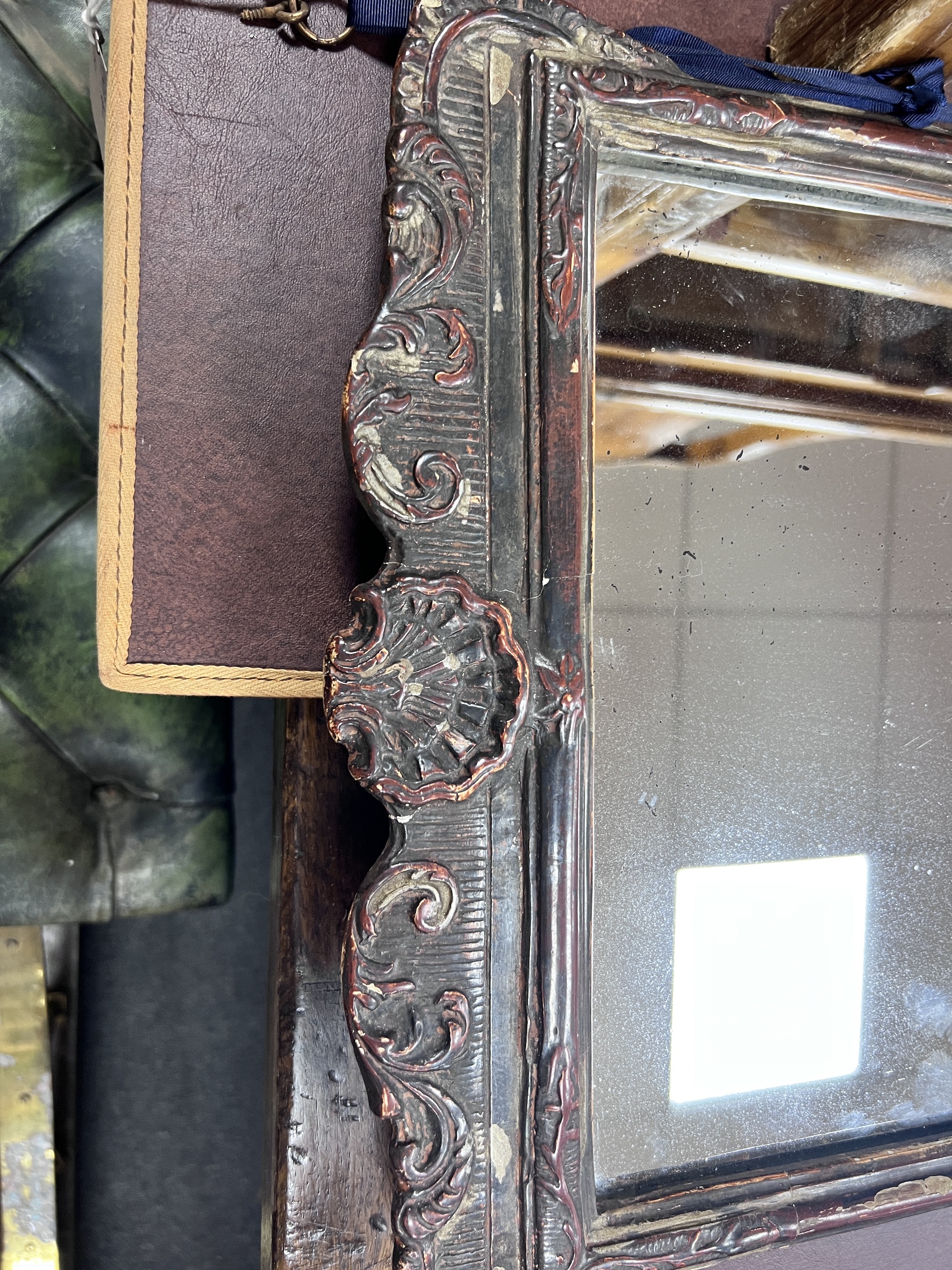 An early 18th century style carved and moulded wall mirror, width 39cm, height 61cm